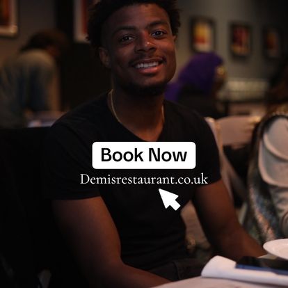 An image of a young man smiling in in demis restaurant and a triger text to book a table now.