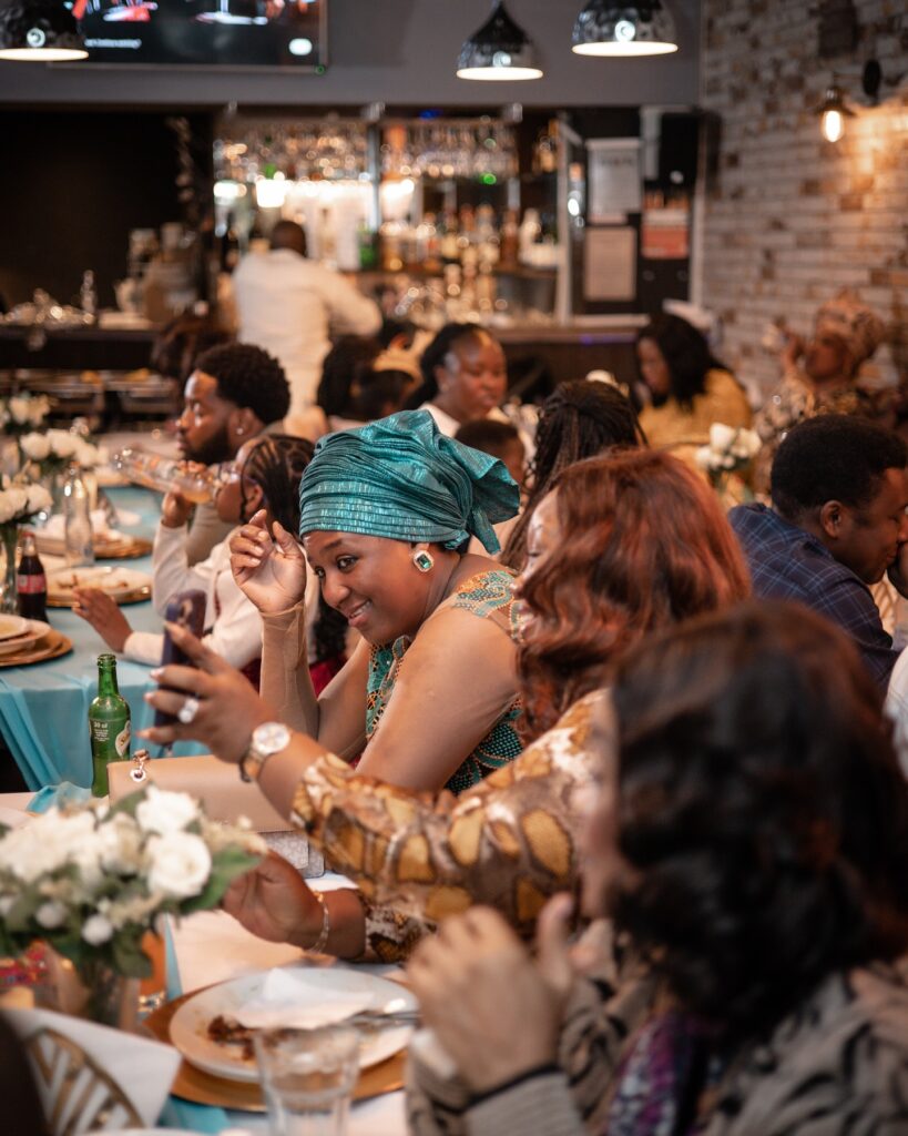 A arge group of people having a buffet at demi's nigerian restaurant